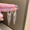 Close-up of elegant silver long tassel link chain drop earrings with high shine finish - Inverted Triangle Thin Chain Sharp Tassel (E2984)