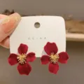 Vintage-style red flocked flower stud earrings with golden stamens on display card. - Flocked Flower Style (E2670) / Red