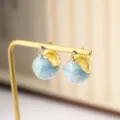 Macro detail of vintage gold hoop earrings with light blue marble enamel glaze finish - Clasp Back / Blue Marble (E3036 Gold Blue)