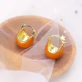 Detail view of vintage caramel enamel hoop earrings with a glossy golden finish. - Clasp Back / Light Orange (E3036 Light Orange)