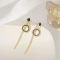 Macro detail of elegant vintage long tassel earrings with black and white rhinestones - Square Tassel Rhinestone Style (E0173) / Gold