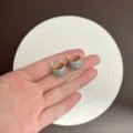 Minimalist grey enamel chunky hoop earrings with gold-tone metal finish held in hand - Clasp Back / Gray (E3036 Gray Blue)