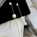 Elegant long gold fringe earrings featuring white pearls and a brilliant accent stone - Asymmetric Artificial Pearl Tassel Style (E0203)
