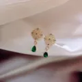 Elegant vintage gold filigree stud earrings featuring emerald green pear-shaped drops - Hollow Floral Green Water Drop Style (E0153) / Gold