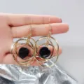 Elegant retro gold multi-layer hoop earrings featuring faceted black bead charms for women - Gold Multi-Ring Black Gem Tassel Style (E0117)