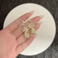 Elegant long gold floral earrings with mesh water drop pendants for women - White Five-Petal Flower Water Drop Tassel Style (E4070) / Gold