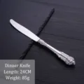 Elegant vintage ornate silver plated stainless steel dinner knife for fine dining settings - Dinner Knife / Silver