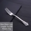 Ornate vintage silver-plated stainless steel dinner fork with royal embossed handle - Dinner Fork / Silver