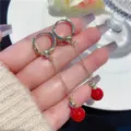 Elegant long gold hoop earrings with vibrant red spherical pendants for a chic look. - Long Link Red Ball Style (E3585 Red Gold)
