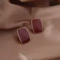 Elegant dark red rectangular enamel stud earrings with a polished gold-tone trim. - Vintage Enamel Rectangle Style (E3575 Red Gold)
