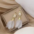 Long gold ear hook earrings with frosted white petal drops and white stone center - Spiral Tassel Style (E1568) / Gold/White