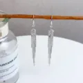 Elegant silver long tassel drop earrings with sparkling crystal accents for women. - Stepped Zirconia Linked Thin Chain Tassel (E3331)