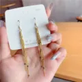 Long gold tassel dangle earrings with S925 sterling silver hooks on white card. - Rhombus Sequin Long Tassel Style (E3396 Gold)