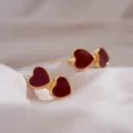 Elegant double red heart stud earrings with gold finish and enamel inlay - Double Heart Enamel Gold Rim Style (E3490)