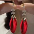 Elegant long red rose bud drop earrings with crystal leaf accents and gold hardware - Rosebud Long Temperament Earrings (E3319)