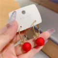 Elegant gold hoop earrings with matte red spheres and crystal butterfly accents - Bow Matte Red Bead Hoop (E3333)
