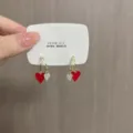 Elegant gold earrings featuring a red enamel heart and a sparkling rhinestone charm - Enamel Heart Rhinestone Style (E3118 Gold)