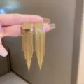 Elegant long gold tassel drop earrings with circular stud design. - Round Fan Tassel Style (E3076) / Gold