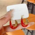 Elegant red and gold U-shaped thick hoop earrings shown on a white display card - U-Shaped Horseshoe Hoop Style (E3055 Red Gold)