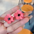 Charming pink flower stud earrings featuring a black gemstone center for a chic look - Contrast Color Flower Stud Style (E3041 Red)