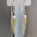 Elegant gold-tone tassel earrings with lavender pearls, chic Korean style dangle design. - Triangle Pink Purple Pearl Tassel Style (E3011) / Gold/Purple