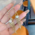 Elegant gold dangle earrings featuring white pearls and long hanging bead tassels - Beaded Tassel Style (E3011) / Gold/White
