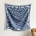 Elegant blue and white floral silk square scarf hanging on a minimalist white wall for display - 90x90cm/Pack / Blue