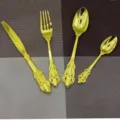 Elegant 4-piece vintage gold cutlery set with ornate embossed handles for weddings. - Gold 4-Piece Set