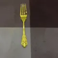 Elegant vintage royal style golden dinner fork with intricate floral handle engraving - Gold Fork