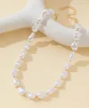 Vista dettagliata di una collana di perle barocche con distanziatori dorati - Perla Irregolare con Distanziatori in Metallo (XL3701) / Bianco (03 Oro)