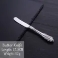 Vintage European style 304 stainless steel butter knife with ornate floral relief pattern - Stainless Steel Butter Knife / Silver