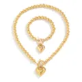 Elegante set di collana e bracciale in perline dorate con ciondoli a cuore e chiusure OT - set collana e bracciale / Oro