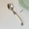 Cream white curved handle stainless steel dinner spoon measuring 20cm in total length - Single Dinner Spoon