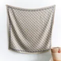 Detail of geometric square silk scarf with navy blue border and champagne beige patterns - 90x90cm / Gray