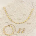 Set di gioielli margherita in stile bohémien con collana, bracciale e orecchini eleganti. - Margherita Bianca