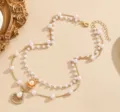 Elegante collana di perle a doppio strato dorata con ciondoli a conchiglia per donne - Collana