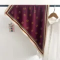 Detail of a burgundy silk triangle scarf with retro fan patterns and stripe borders - Triangle Scarf (TBSJJ69) / 87x130cm / Red Fan Pattern