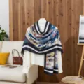 Artistic floral cotton linen scarf draped over a white blouse in a cozy home setting - Blue / 180x85cm