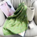 Elegant green silk scarf with cute cartoon dog print patterns styled on a handbag - 65*65 / Green