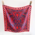 Detailed view of red and blue baroque pattern on a square silk-like scarf hanging - 65*65 / Red and Blue