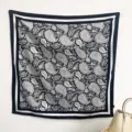 Detail showing black and white paisley cashew flower print on large square scarf - RY-46