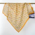 Vintage cotton floral square scarf with daisy print, draped elegantly on a rod. - RY-05