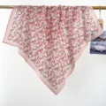 Elegant pink floral 100% cotton square scarf draped over a rod for detail view - RY-06