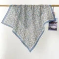 Detailed view of a vintage 100% cotton floral square scarf with a navy blue border trim - RY-08