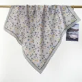 Detailed view of grey floral print cotton square scarf draped elegantly on a display rod - RY-17