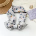 Soft grey cotton floral scarf neckerchief tied in a bow with blue flower pattern - 65x65cm / Gray