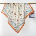 Close-up detail of a pastoral cotton square scarf with colorful butterfly and floral prints - RY-15