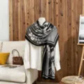 Elegant gray and black floral cotton linen scarf draped on a mannequin indoors. - Black and Gray / 180x85cm