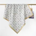 Vintage tile pattern cotton square scarf hanging elegantly on a display rod for detail - RY-49