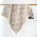Detailed display of vintage floral cotton square scarf draped on a wooden hanging rod - RY-22